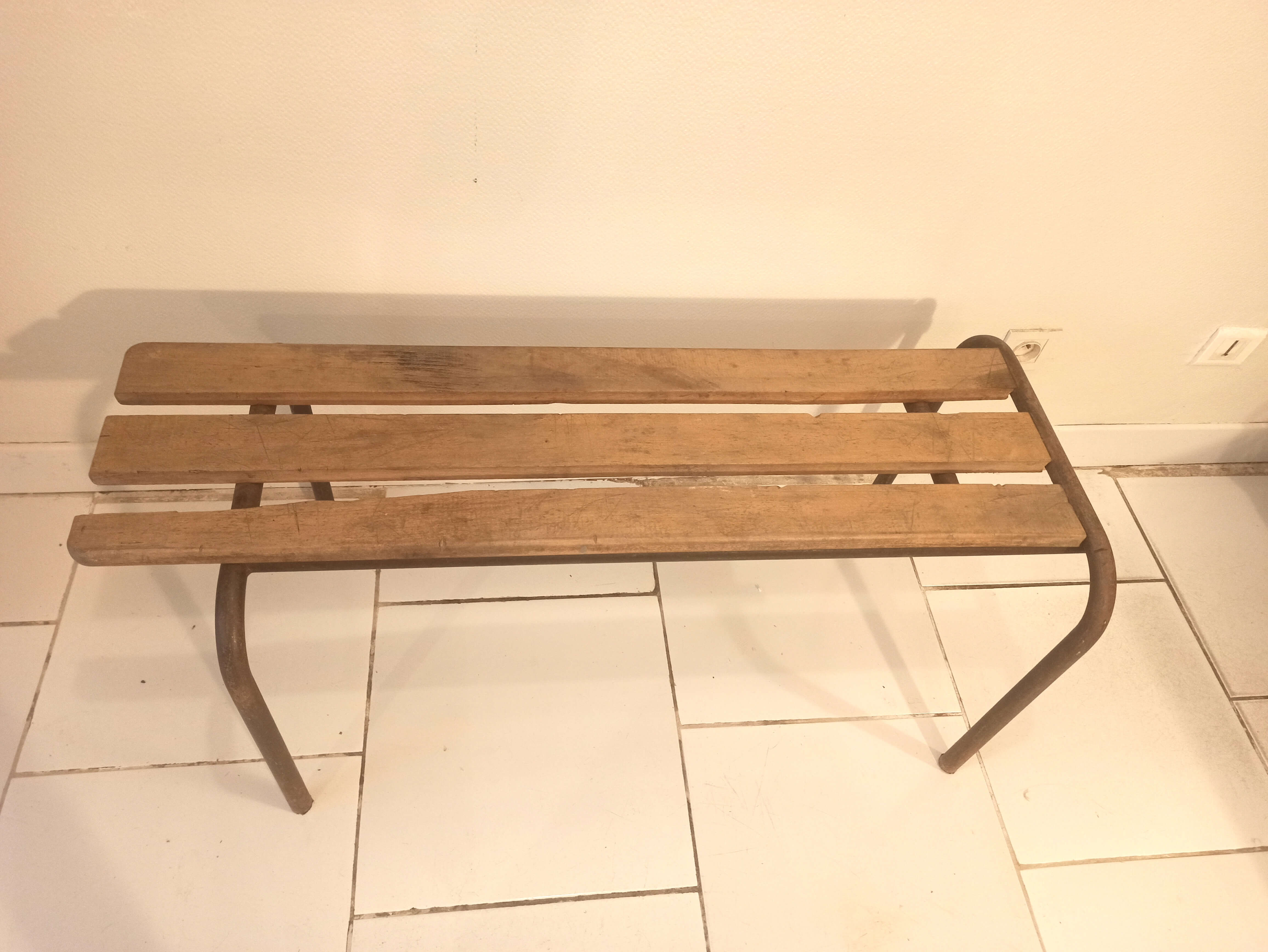 Old bench wooden slats and tubular metal base