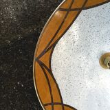 Suspension in the shape of a disc on a seventies style roller
