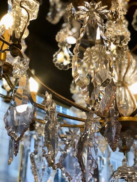 Large chandelier with tassels and old daggers