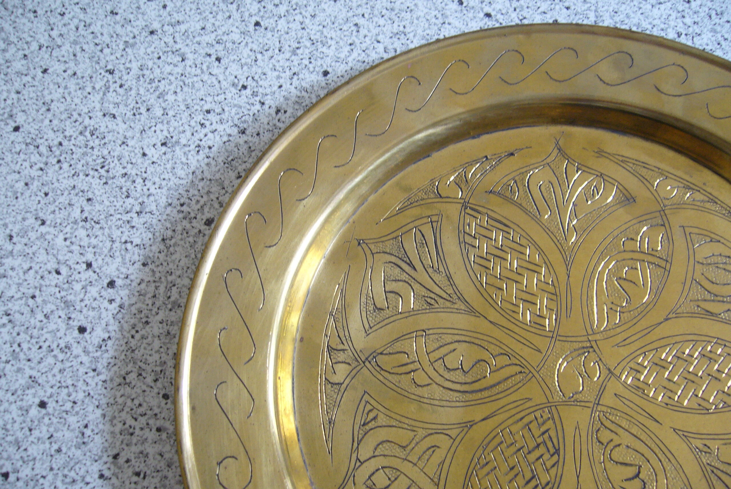 Oriental style chiseled metal plate