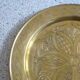 Oriental style chiseled metal plate