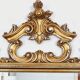 Large Italian mirror in carved wood, traditional gilding, 1980s.