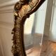 Golden rococo wall mirror