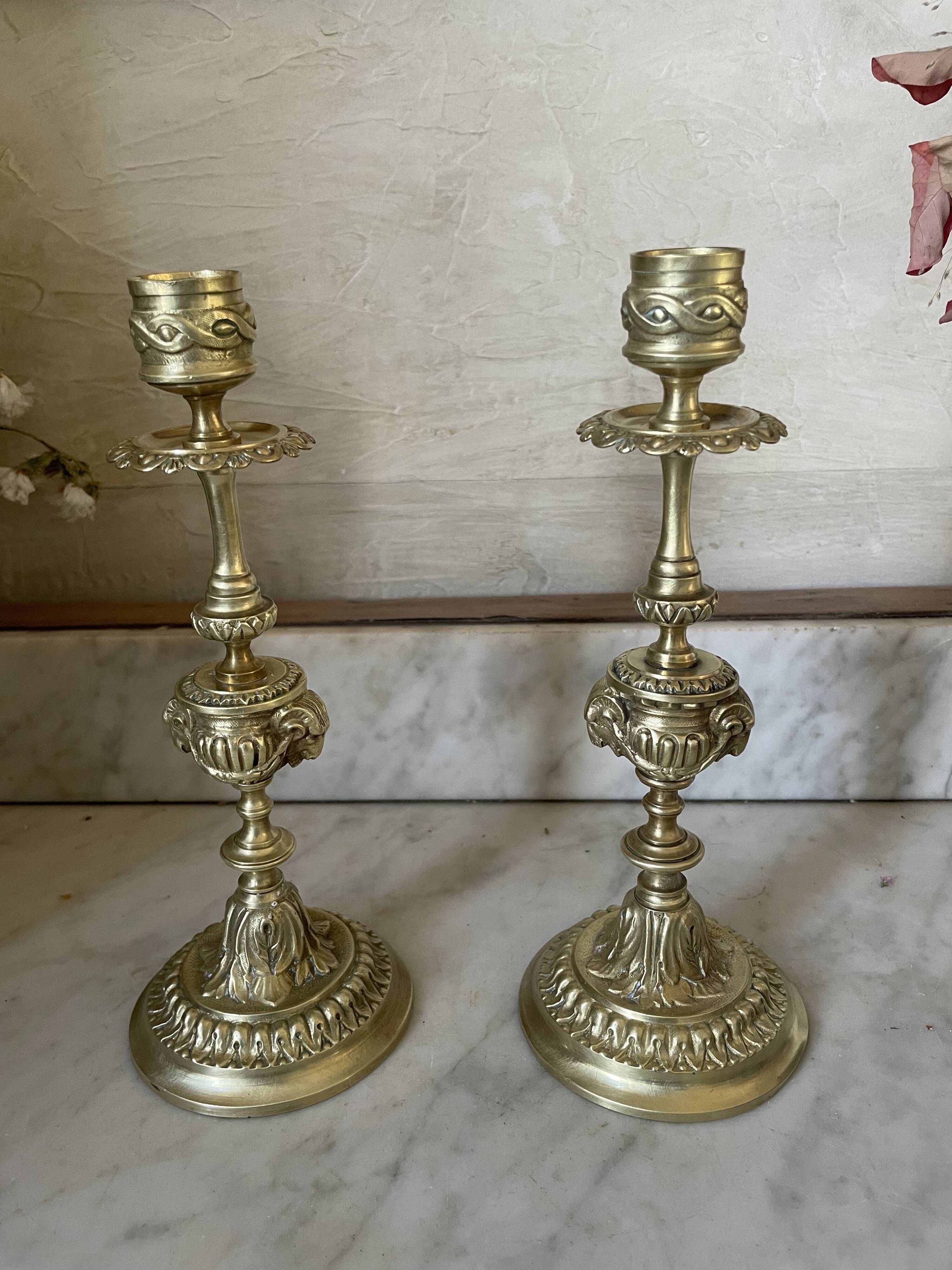 Pair of gilt bronze ram's head candlesticks, Louis XVI style, 19th century.