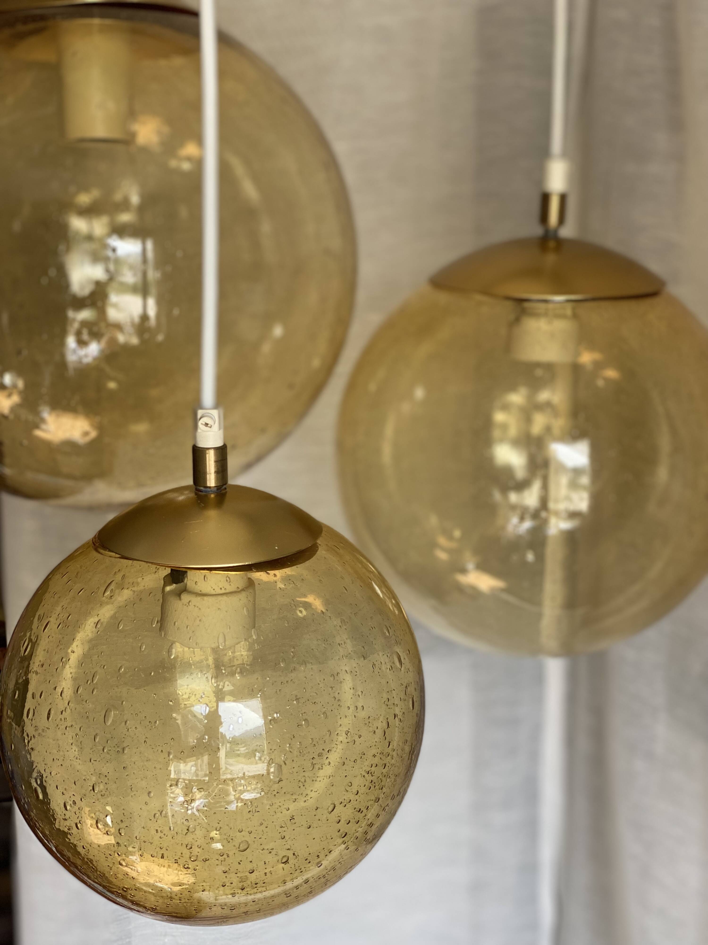 Suspension cascade with 3 globes of vintage golden yellow bubbles from the 1970s.