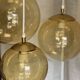 Suspension cascade with 3 globes of vintage golden yellow bubbles from the 1970s.