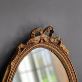 Golden oval mirror with knot