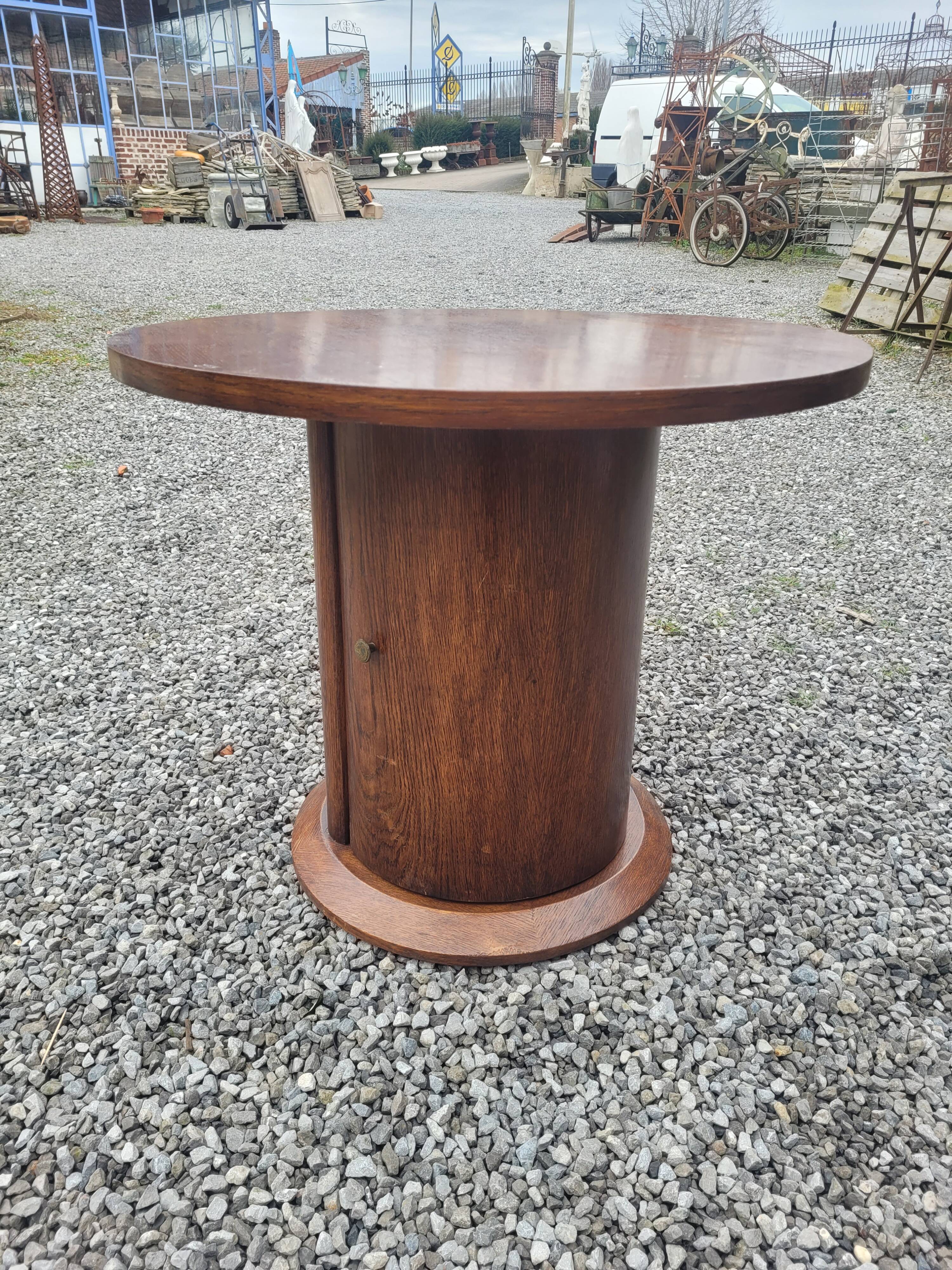 Vintage round oak coffee table with a door