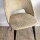 Pair of vintage barrel chairs in boucle fabric with brass splayed legs.