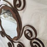 Pair of wrought iron sun mirrors