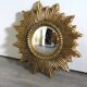 Golden sunburst convex vintage mirror from the 1960s.