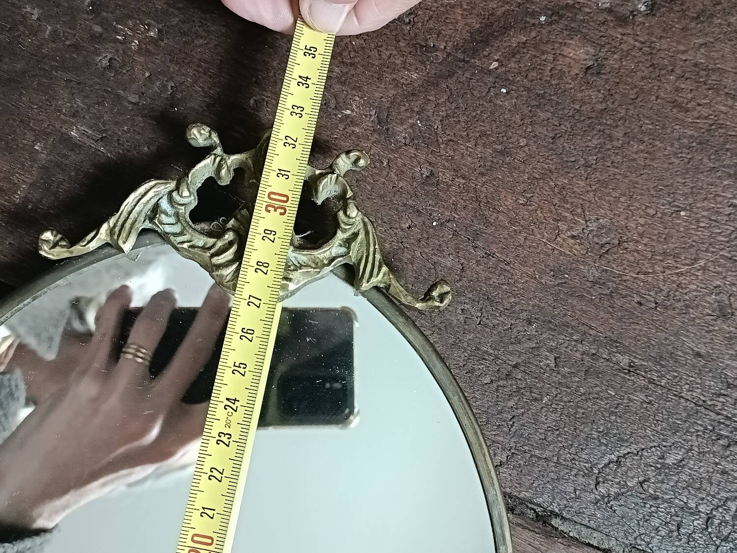 Antique mirror, oval with brass crest
