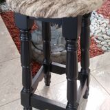 Black bar stool and skin of cattle.