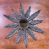 Metal mirror with foliage decoration