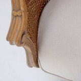 Louis XV style carved armchair with double sided cane work on the side panels