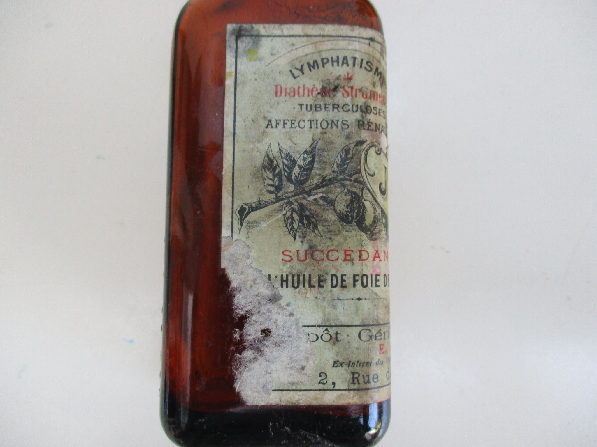 2 amber glass bottles with their old labels