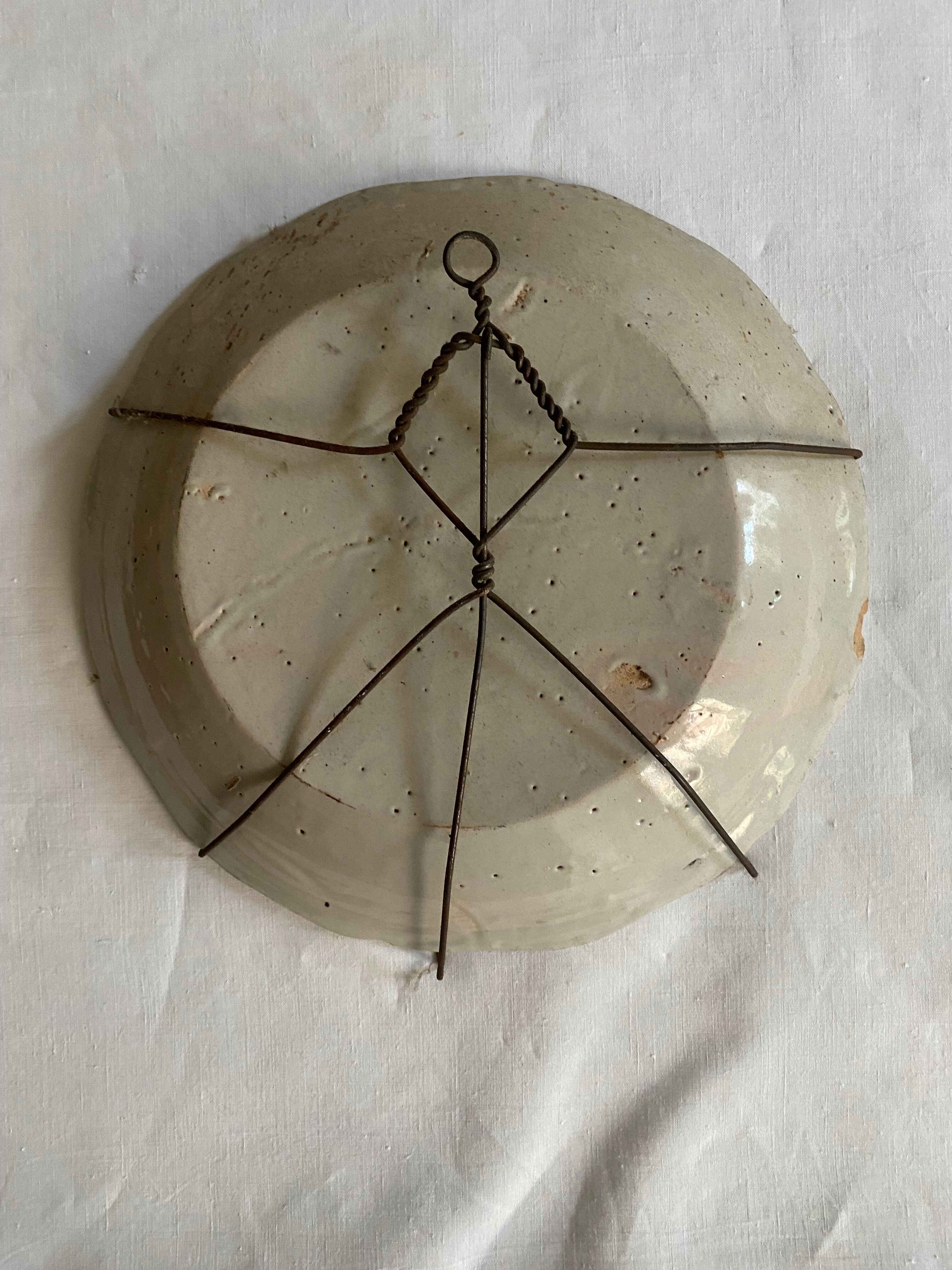 Plate of Nevers in earthenware late eighteenth century decoration of rooster on barrier