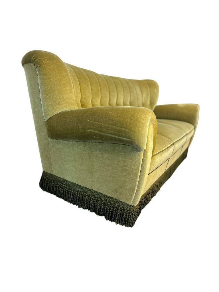 Vintage yellow-green fringed three-seater sofa