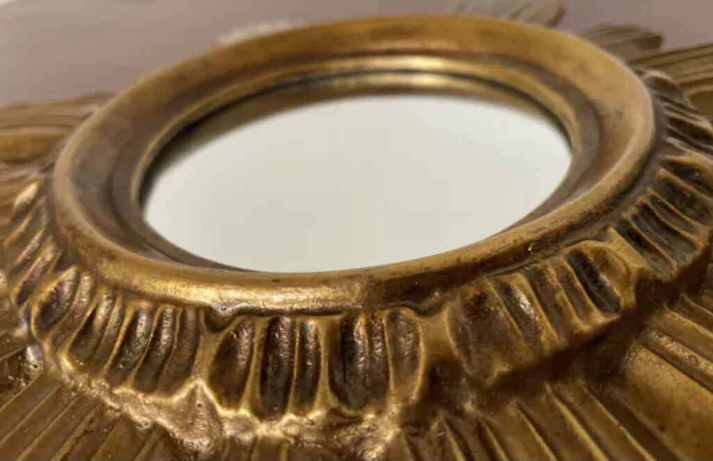 Vintage sun mirror in golden resin 60s/70s