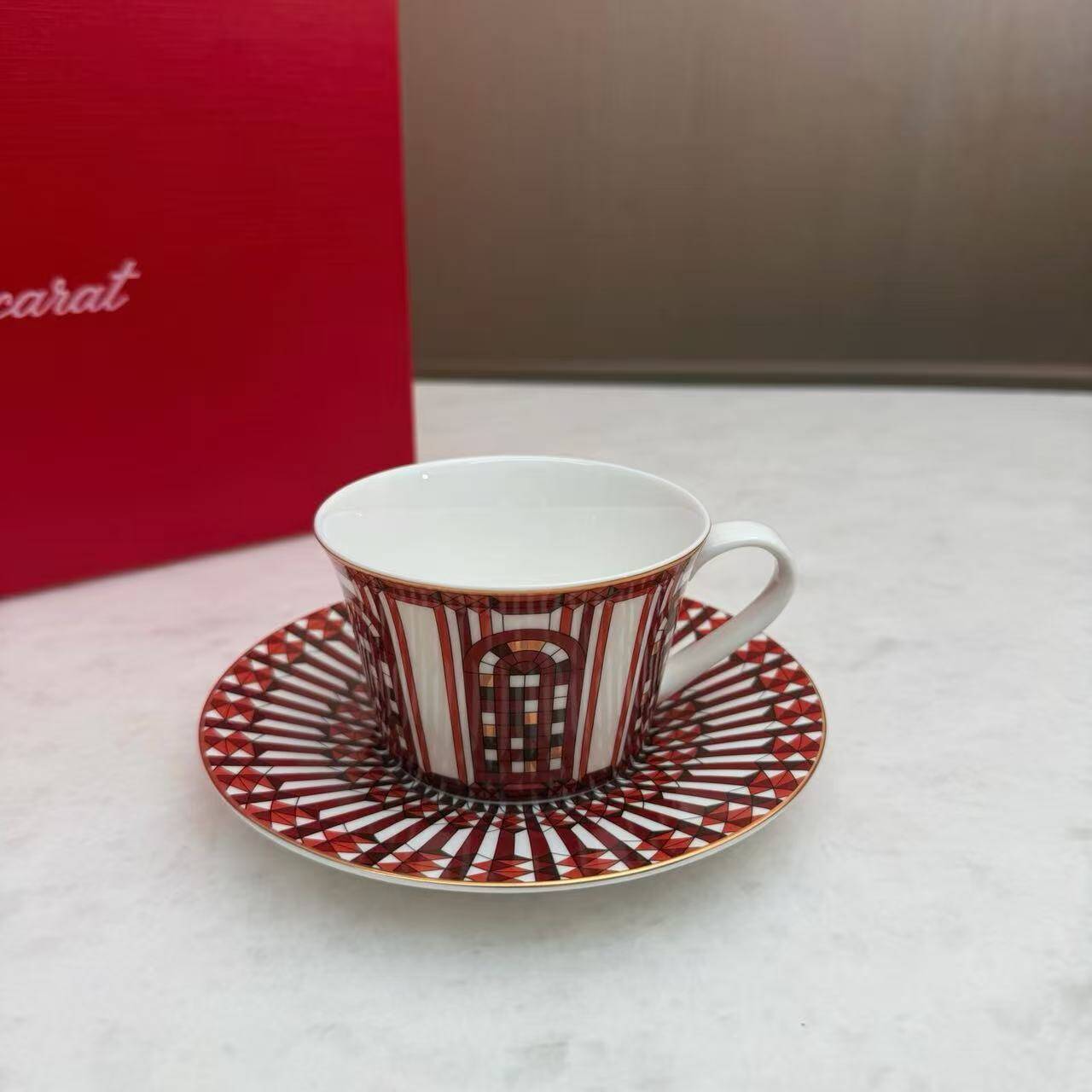 Pair of Baccarat Porcelain Coffee Cups and Saucers, Red Geometric Design