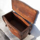 Old chest, carved wooden chest, curved chest on wheels, interior decoration