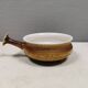 Small ceramic bowl with handle, in golden colours. Danish 1960-70s