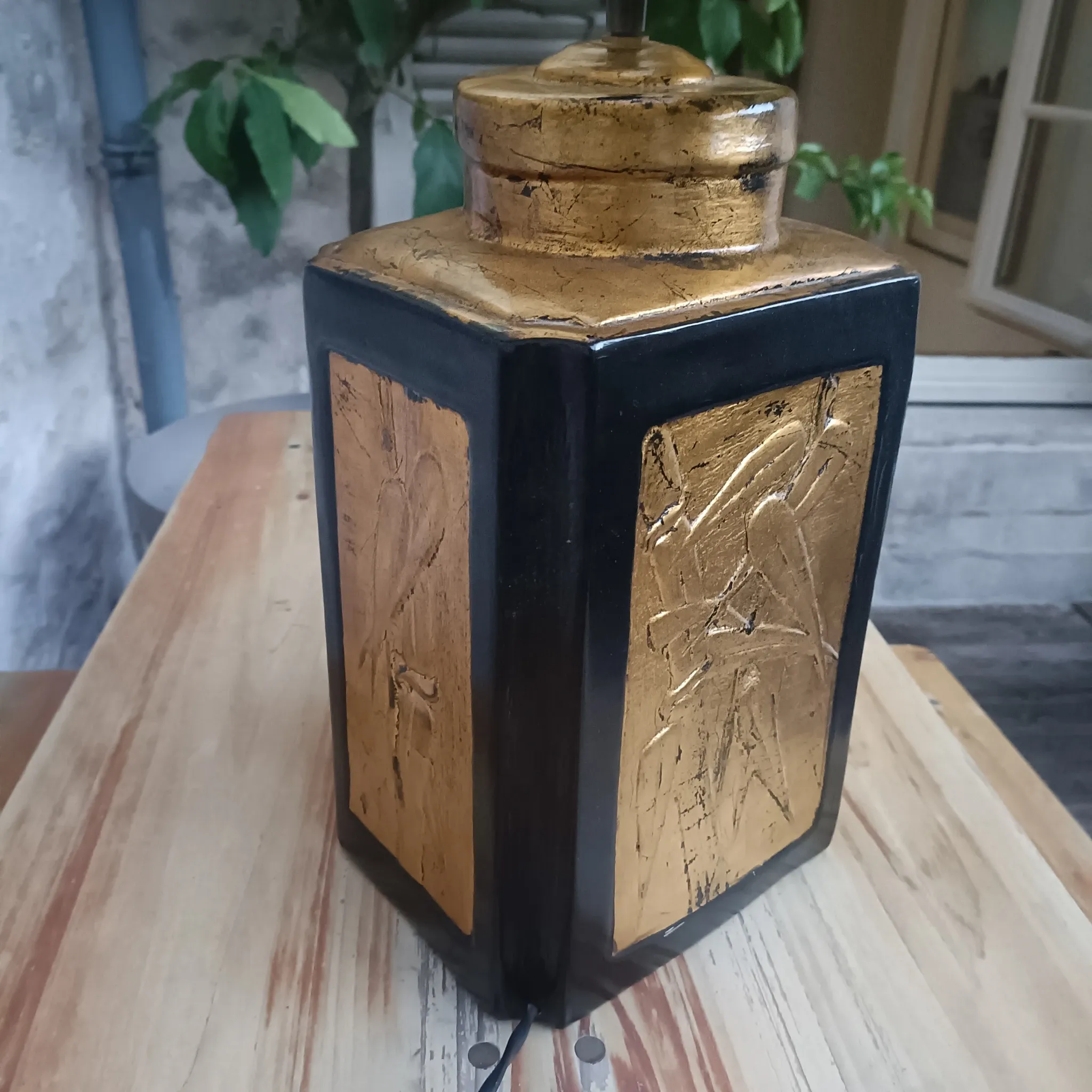 Large ceramic lamp with an Asian theme.