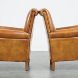 Ensemble de 2 fauteuils en cuir de mouton avec finition passepoil noir
