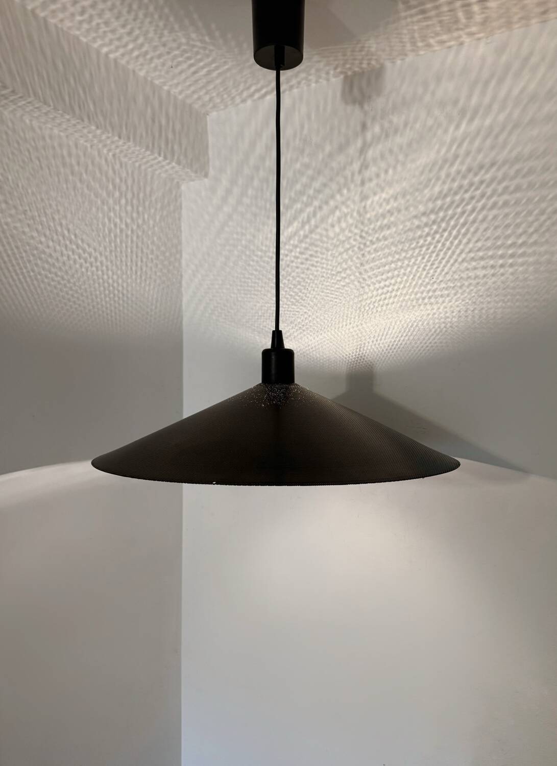 Metal micro-perforated suspension from the 1960s.