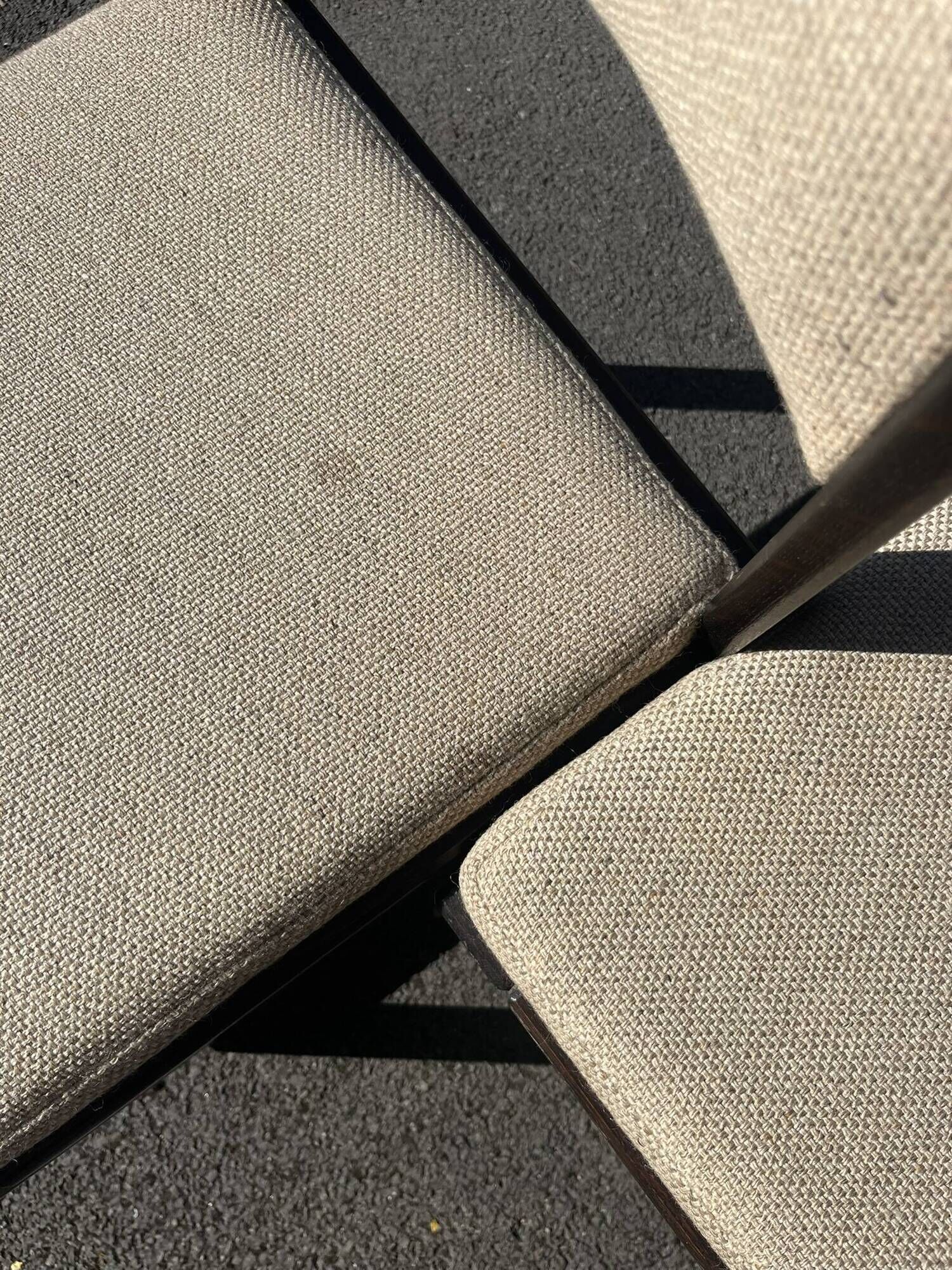 Many mid-century vintage wooden and fabric chairs.