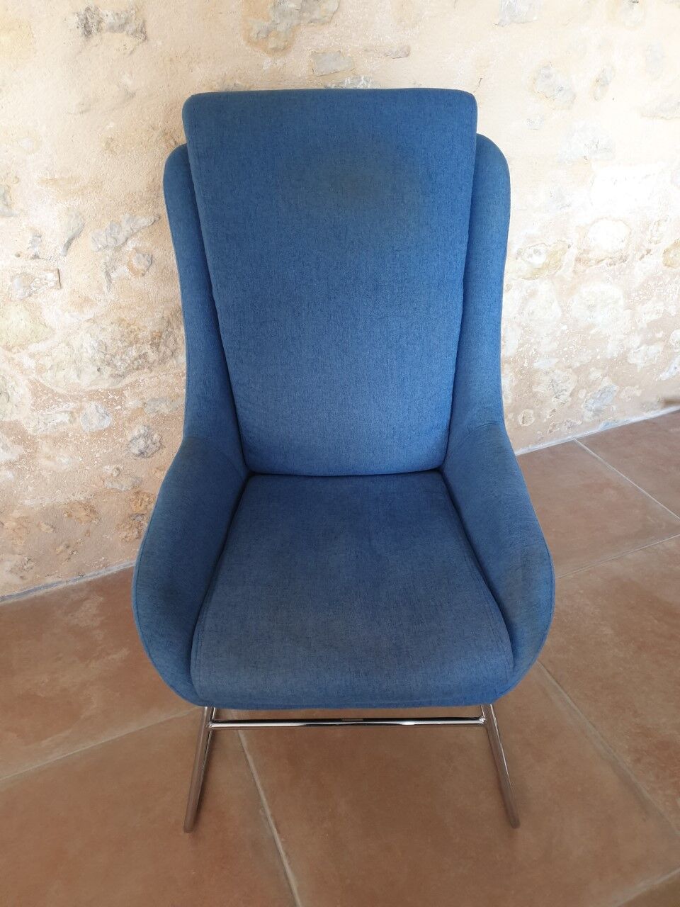 Armchair and its footrest