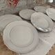 Set of 6 small white porcelain dinner plates with gold trim
