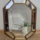 Bevelled mirror with neoclassical parcloses from the 20th century.