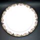Round dish in Limoges porcelain - W. GUERIN & Cie 1900 - decoration floral garlands