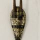 Ancient wooden and brass mask