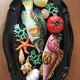 Vintage barbotine dish with fish decoration in relief