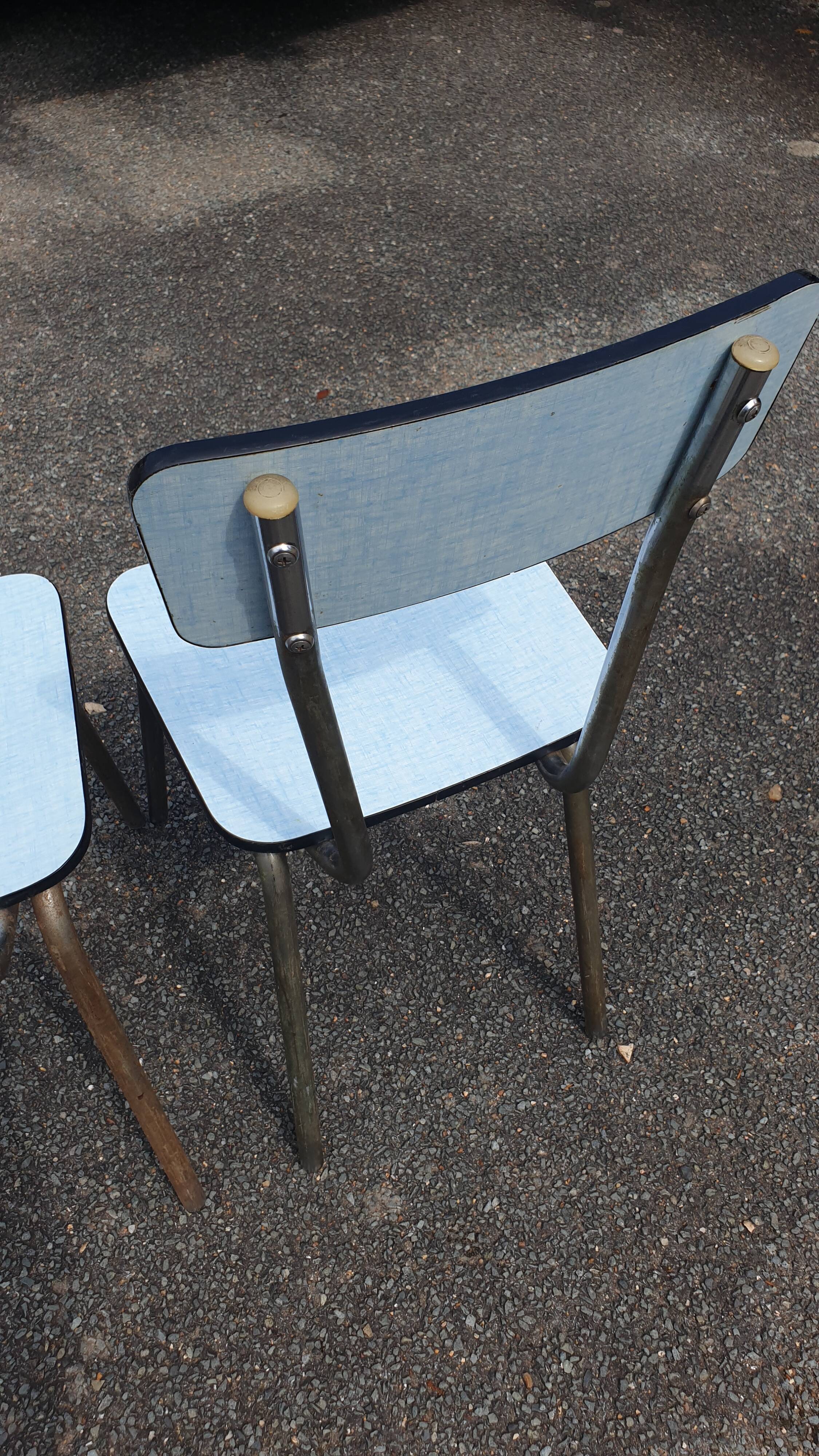 2 sky blue Formica chairs