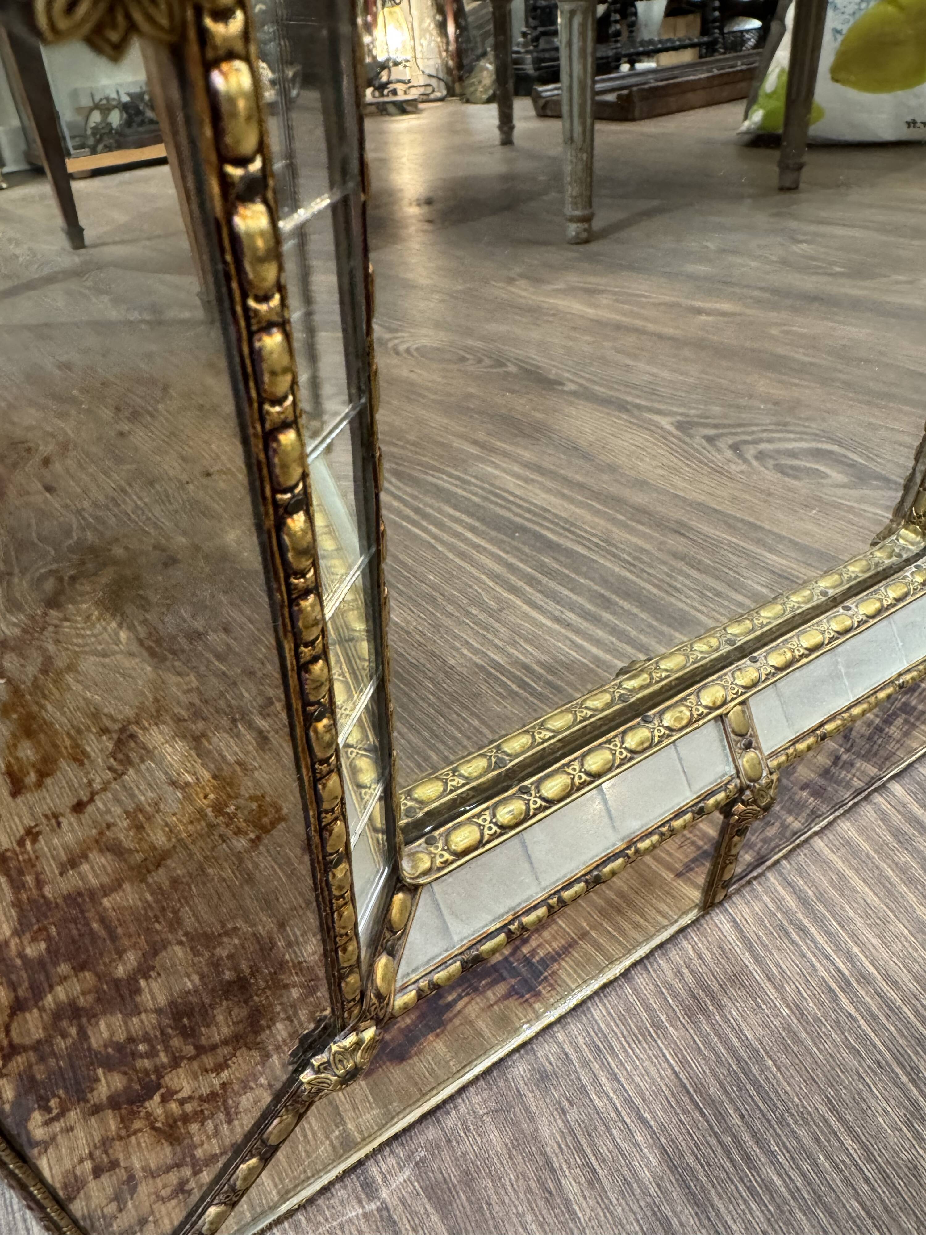 Vintage Venetian mirror with a frame from around 1970.