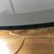 Brass round coffee table and smoked glass