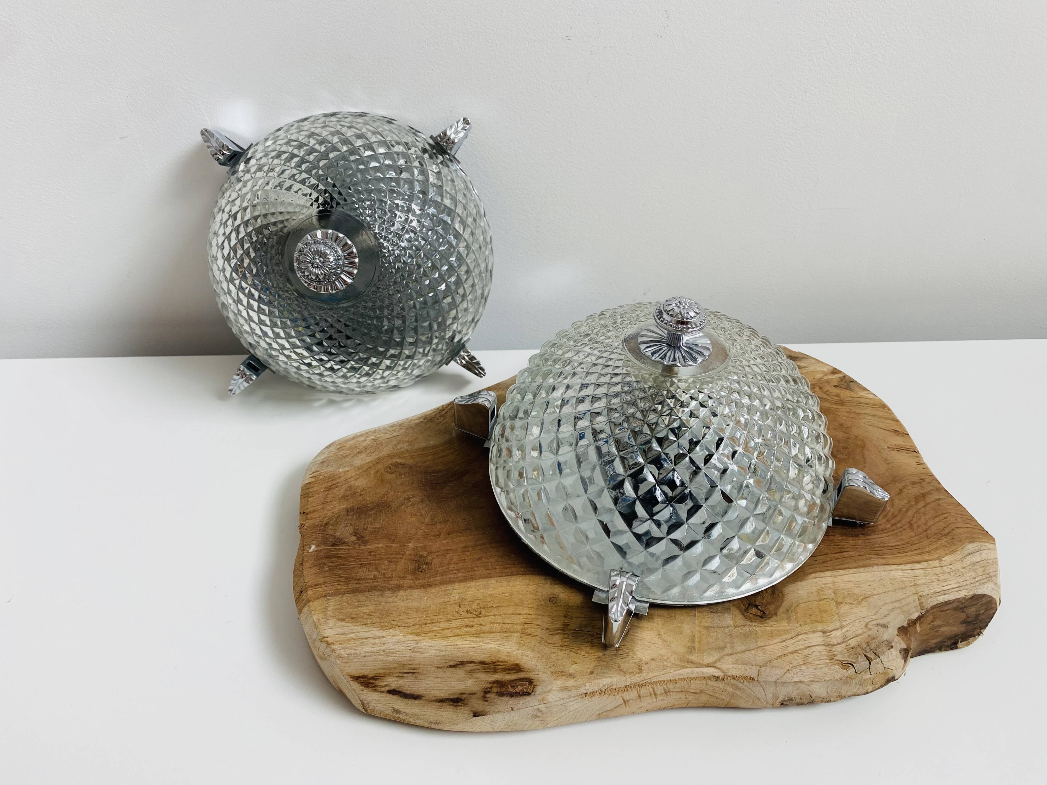 Pair of chrome-plated glass sconces