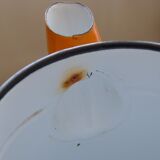 Old orange enamel coffee maker