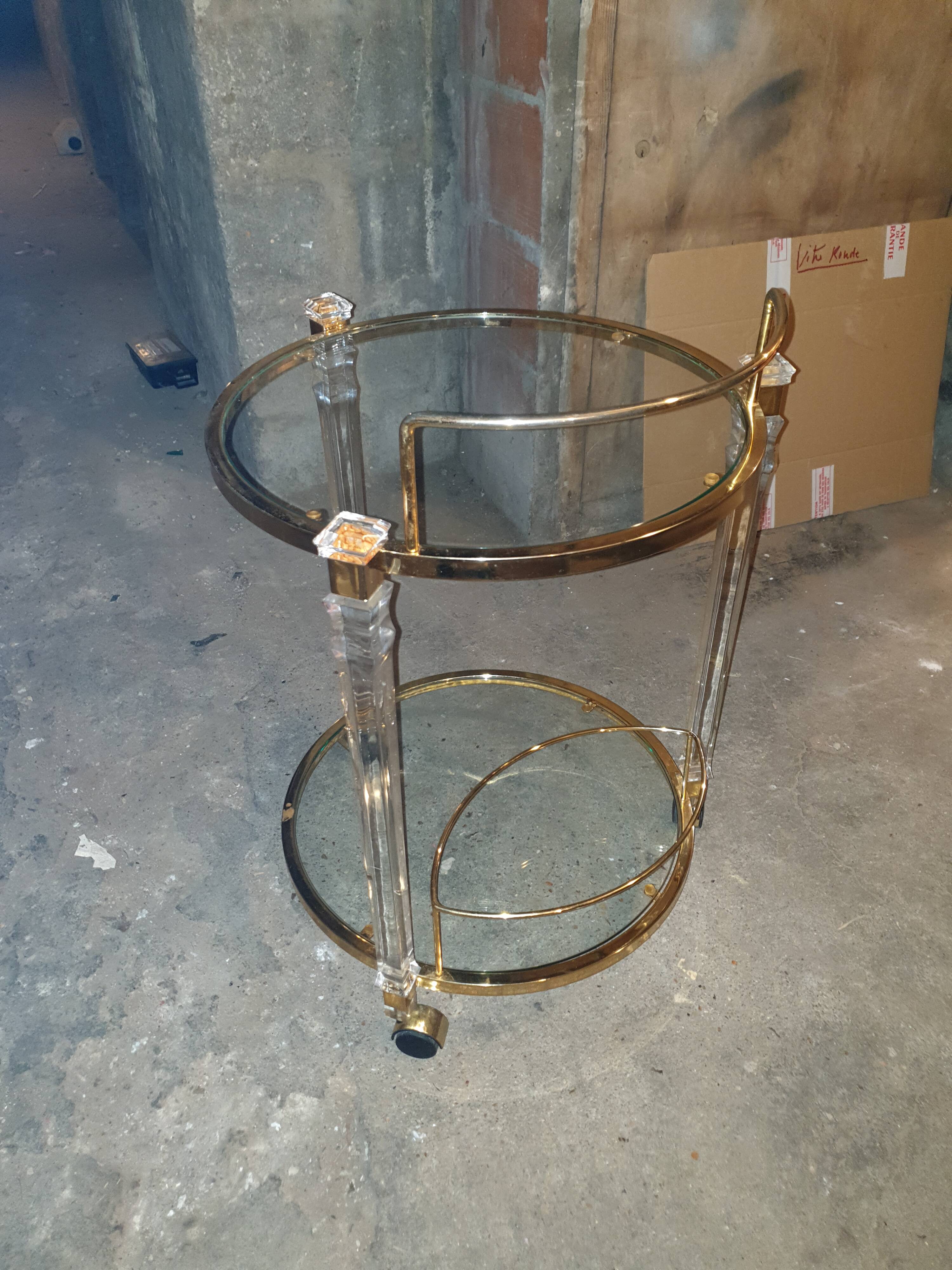 Round table in glass and brass and acrylic columns, 1980