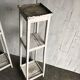 Two white vintage mid-20th century wooden plant stands, 3-tier shelves.