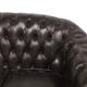 Three-seater black leather chesterfield sofa