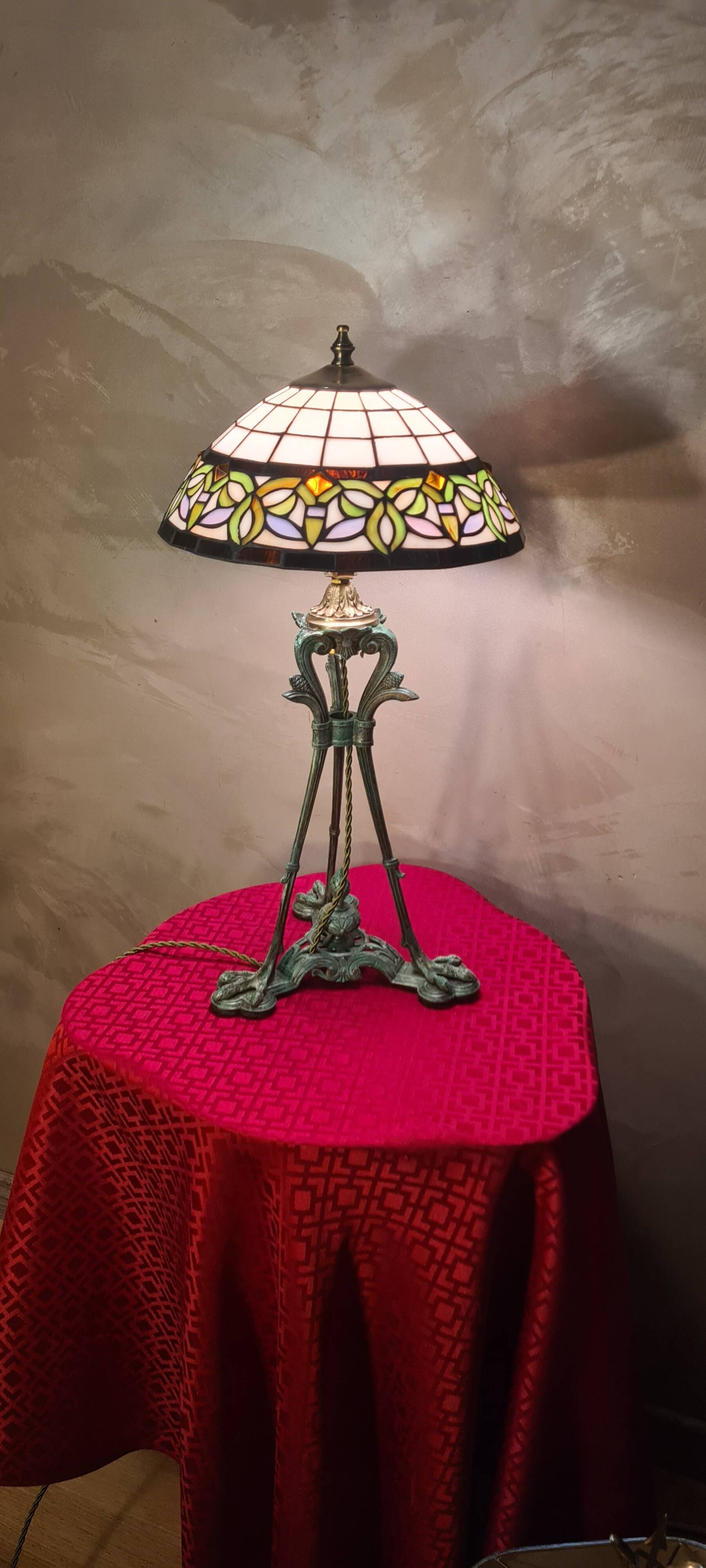 Antique patinated bronze regulator lamp with Tiffany glass shade in very good condition