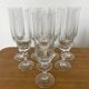 Set of 8 crystal champagne flutes in classic design.