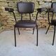 Brown faux leather armchairs