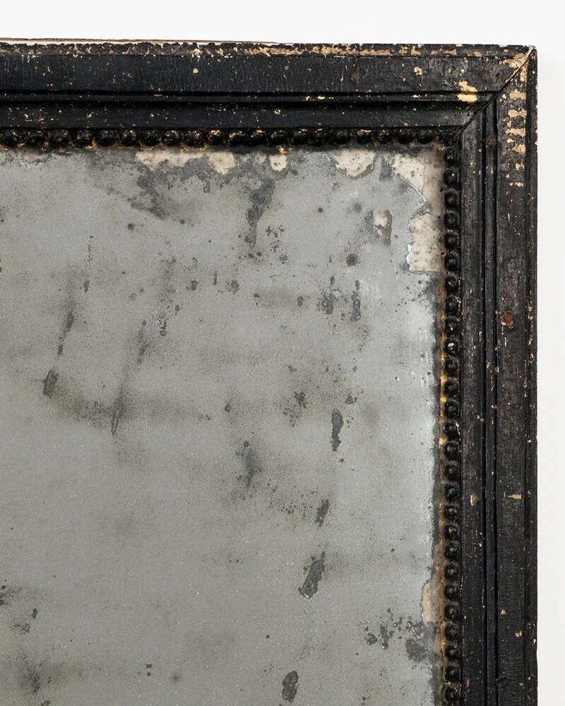 Antique French mirror from the late 19th century with a black painted frame.