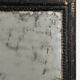 Antique French mirror from the late 19th century with a black painted frame.