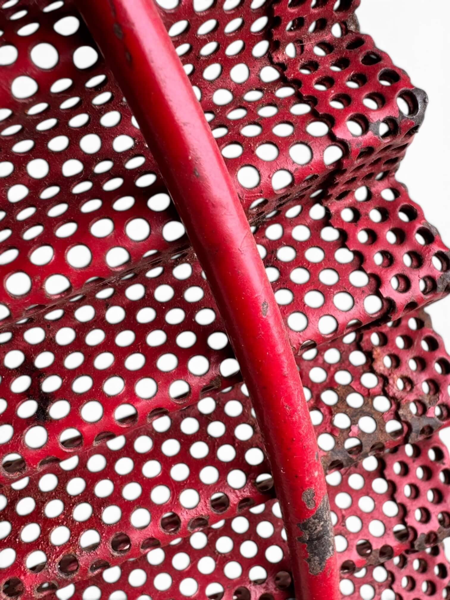 Mathieu Matégot, fruit bowl from 1953 in perforated metal with a red lacquer finish.